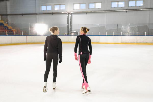 Photograph of 2 ice skaters on an ice rink