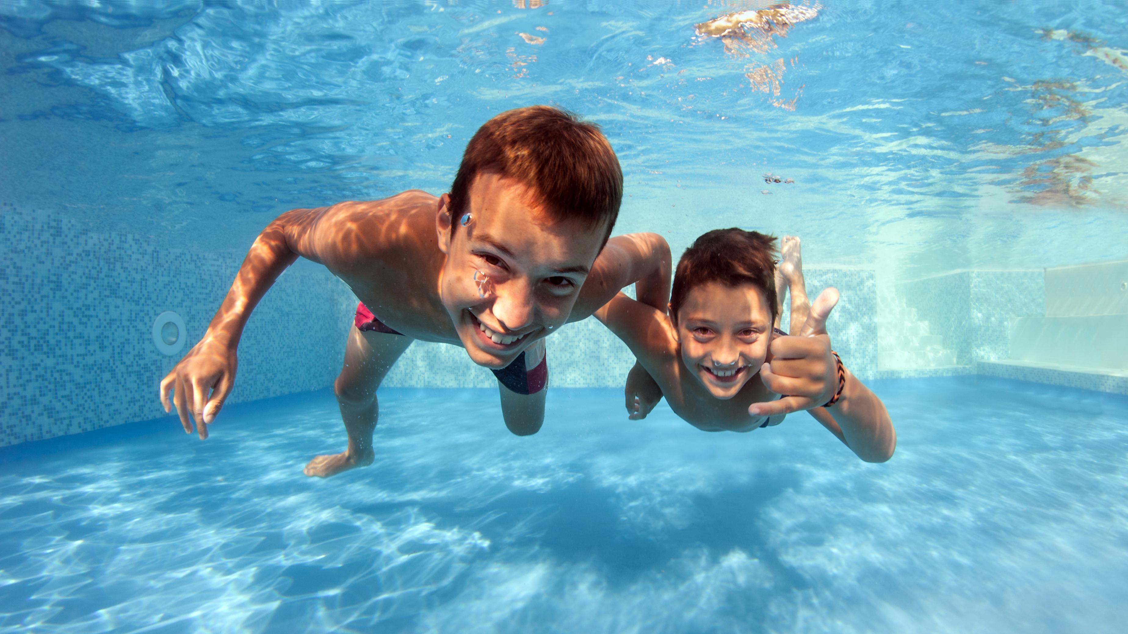 Two boys swimming