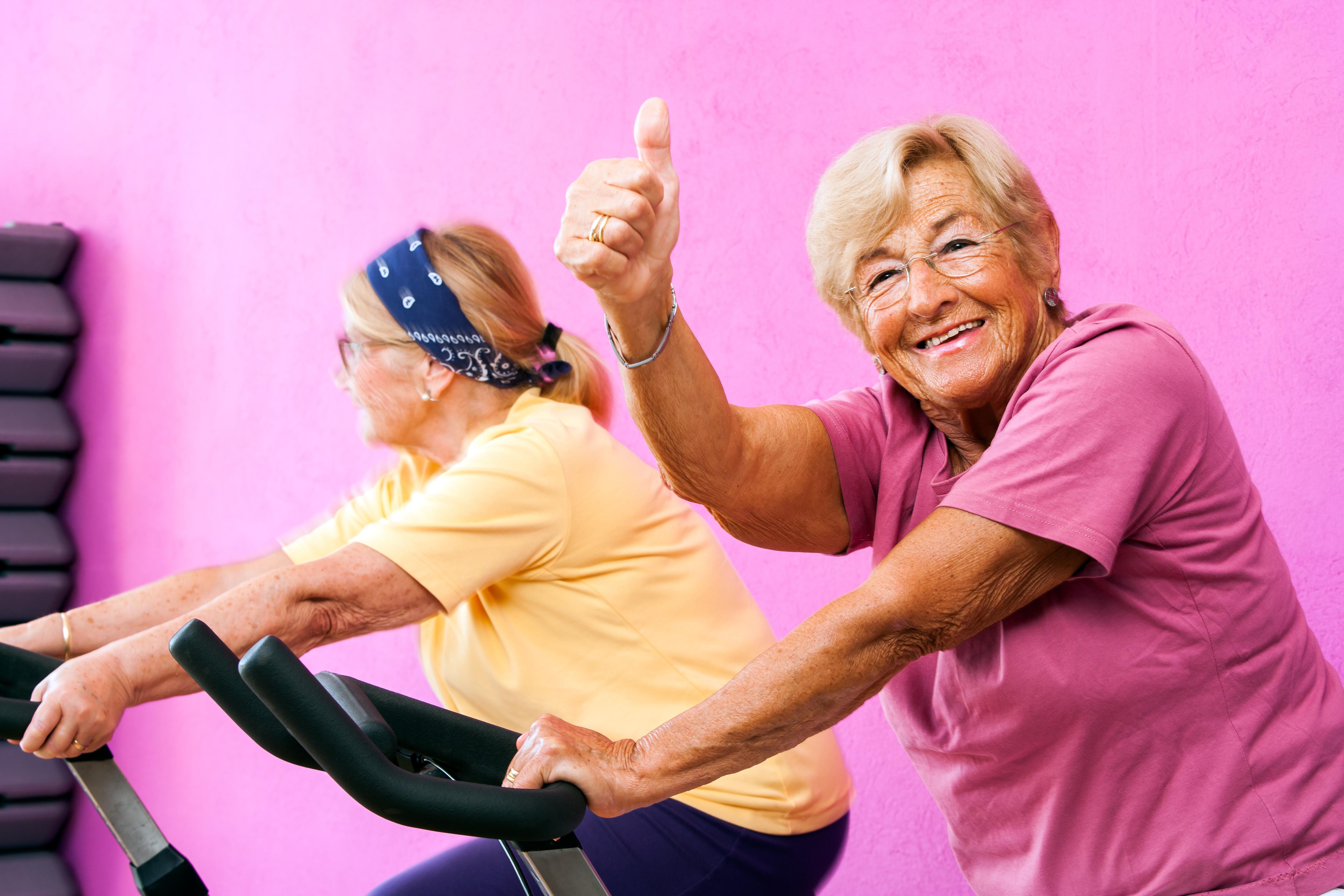 An image of two senior ladies exercising