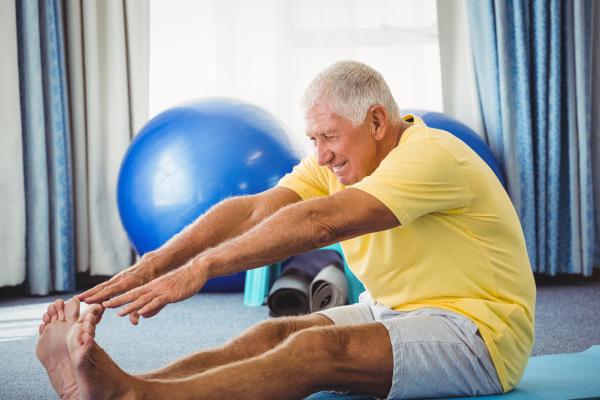 an image of a senior man exercising and stretching